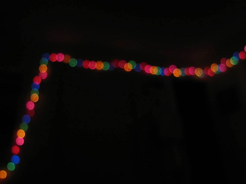 blurry, colorful balls of light in the dark